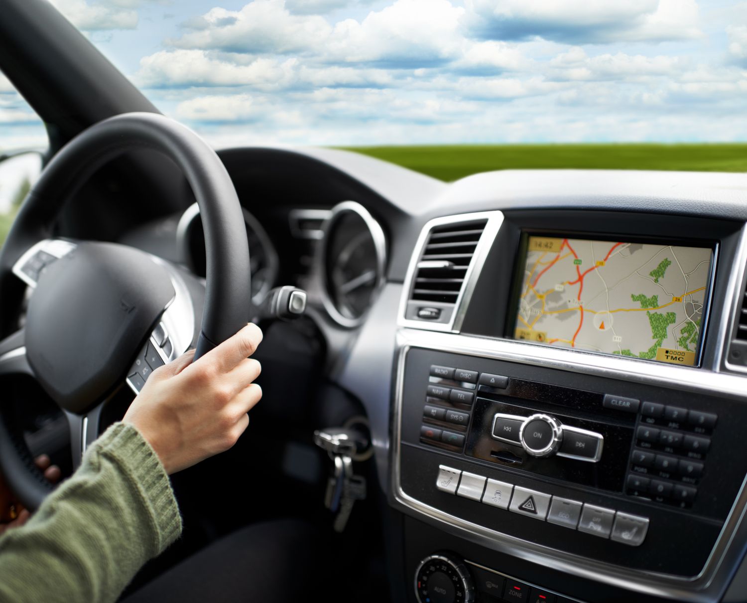 person using GPS in car